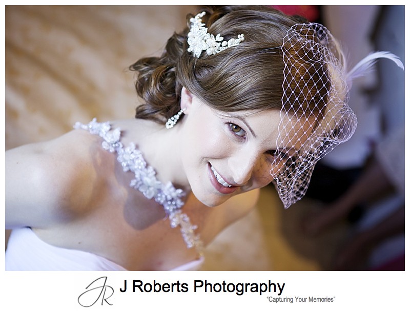 Portrait of a bride looking up at the camera - sydney wedding photographers 